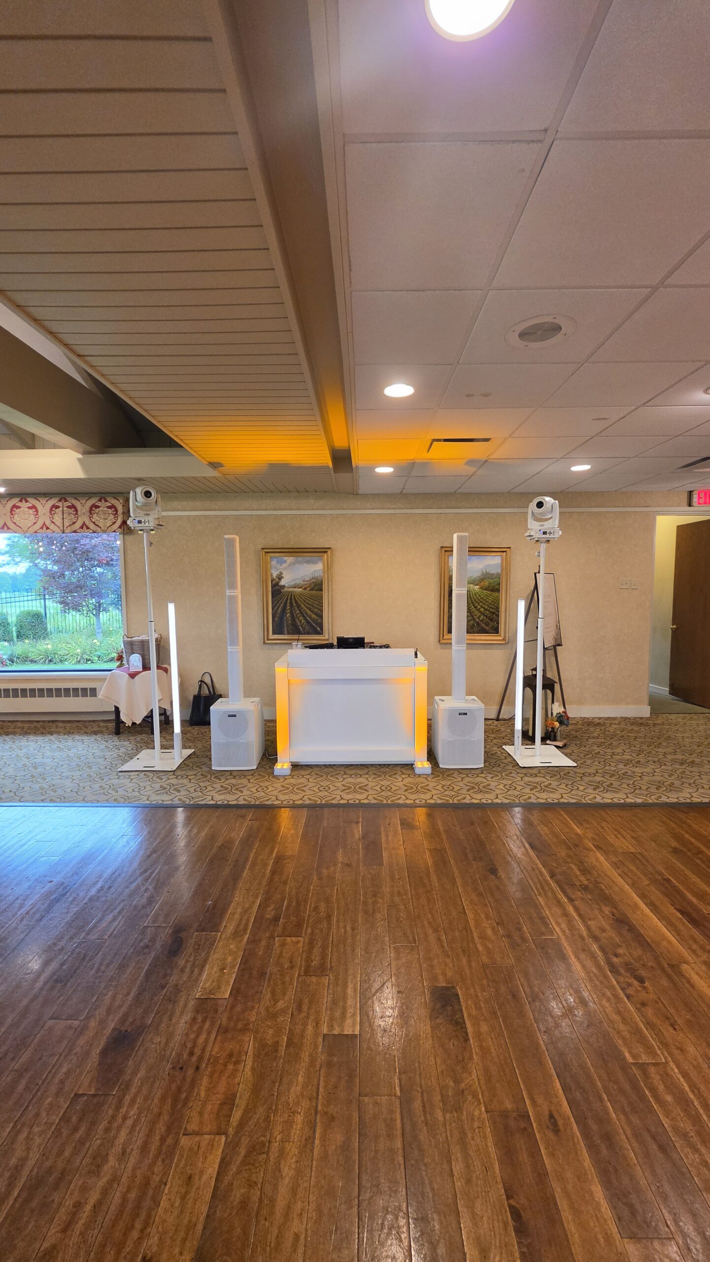 1021 Events white wedding DJ booth and lighting setup at Kenosha Country Club
